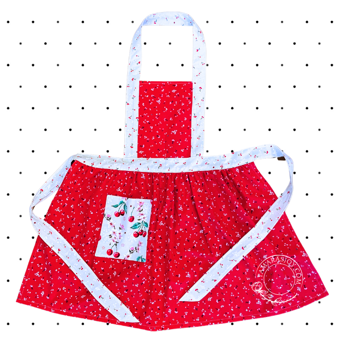 Red Adult Kitchen Apron in Red with images of cherries on them.