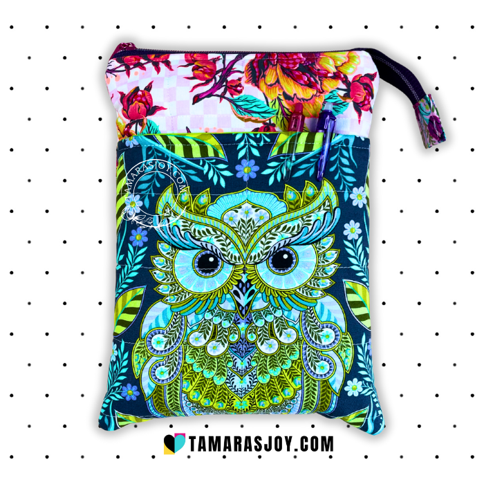 Fabric pouch with owl design and floral pattern on a white background
